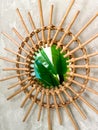 Decorative mirror made of branches on the wall