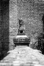 Decorative monument in the shape of lion. Black and white photo