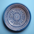 Decorative Moroccan ceramic hand painted plate, handmade, isolated, closeup top view.