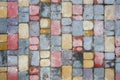 Decorative multi-colored tile for the sidewalk after the rain. Top view. Royalty Free Stock Photo