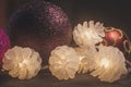 Decorative multicolor christmas balls with glowing cones on dark background.