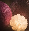 Decorative multicolor christmas balls with glowing cones on dark background.