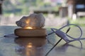 Decorative night lamp and stones crystal. beautiful mystical composition with quartz crystal on a larch wood stand