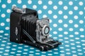 Decorative Old Antique Camera on Blue Background Royalty Free Stock Photo