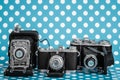 Decorative Old Antique Cameras on Blue Background Royalty Free Stock Photo