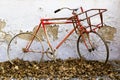 Decorative old bicycle against an old peeling wall Royalty Free Stock Photo