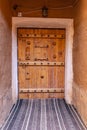 Decorative old wooden door in the Ushaiger Heritage Village