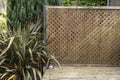Openwork wooden cladding on the edge of a garden terrace Royalty Free Stock Photo