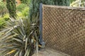Openwork wooden cladding on the edge of a garden terrace Royalty Free Stock Photo