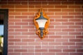 decorative outdoor light fixture on red brick wall Royalty Free Stock Photo