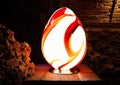 Decorative oval lamp in the form of an egg