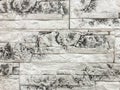 Decorative panel with effect of old cracked white brick wall, closeup Royalty Free Stock Photo