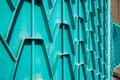 Decorative parts of metal gates. Metal turquois fence. Texture o