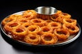 a decorative pattern made with onion rings on a tray