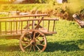 Decorative Peasant Cart On Summer Lawn. Bright Sunny Day. Garden Decoration Concept. Gardening And Housekeeping. Vintage Royalty Free Stock Photo