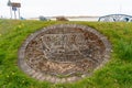 Decorative pebble mosaic of a historic boat, on the shore in the coastal village of Ravenglass, UK