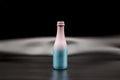 Decorative pink-blue glass wine bottle Royalty Free Stock Photo