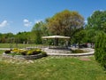 Decorative place for ceremonies or entertainments. Outdoor reception under tents and trees. Royalty Free Stock Photo