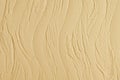 Decorative plaster. Wall stucco texture. In style waves, beige color.