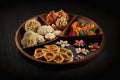 Decorative Plates And Tray With Delicious Gujia Or Gujiya Mithai Jalebi Ghewar Dry Fruits And Colorful Gulal Abeer Or Abir For