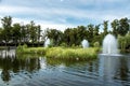 A decorative pond with small islands with reeds and fountains. Royalty Free Stock Photo