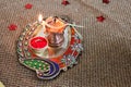 decorative pooja thali with oil lamp and Kumkum