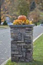 A Decorative Pumpkin On A Concrete Support Column. Royalty Free Stock Photo