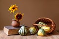 Decorative pumpkins and sunflowers in a vase Royalty Free Stock Photo