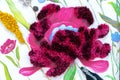 Decorative purple faux fur flower. Wall panel with a shaggy flower