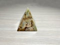 Decorative pyramid of onyx close-up. Pyramid of beautiful onyx stone