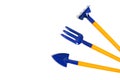 Decorative rake, pitchfork and shovel, garden tool on white