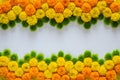 Decorative rangoli made from colorful marigold flowers and green Chrysanthemum for Diwali festival