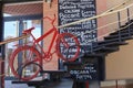 Decorative red bicycle on the stairs of an Italian cafe. Selective focus background Royalty Free Stock Photo