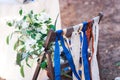 Decorative red, blue and white ribbons on chair. Decorated chairs with red bows in a row. Royalty Free Stock Photo