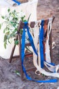 Decorative red, blue and white ribbons on chair. Decorated chairs with red bows in a row. Royalty Free Stock Photo