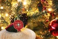 Decorative red Christmas pomegranate in front of the Christmas tree