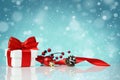 Decorative red gift box with a white bow with chtistmas decorations Royalty Free Stock Photo