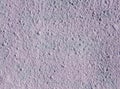 Decorative relief light purple plaster on wall Royalty Free Stock Photo