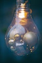 Decorative retro design edison light bulb. Christmas ornaments made from light bulbs. LED lamps in vintage and antique style Royalty Free Stock Photo