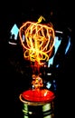 Decorative retro Edison style filament light bulb with the reflection. Royalty Free Stock Photo