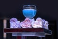 Decorative rose flowers next to candle