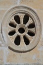 Decorative round window close-up in the ancient church, Montenegro Royalty Free Stock Photo