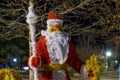 Decorative Santa Claus With Gifts, Made Of Christmas Tinsel. Background