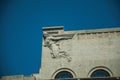 Decorative sculpture in Deco style on top of of building in Madrid