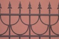 Decorative Sharp bronze fence isolated on brown