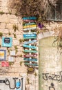 Decorative sign with directions to objects hanging on the wall of the house of Nazareth old city in northern Israel