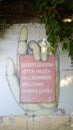 Decorative sign-welcome in different languages in the form of a hand and index finger