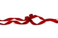 Decorative silk red ribbon with a bow on isolated white background. Cut out. Royalty Free Stock Photo