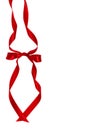Decorative silk red ribbon with a bow on isolated white background. Cut out. Copy space. Royalty Free Stock Photo