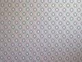 Decorative silk wallpaper, geo-geometric pattern. A close-up shot.